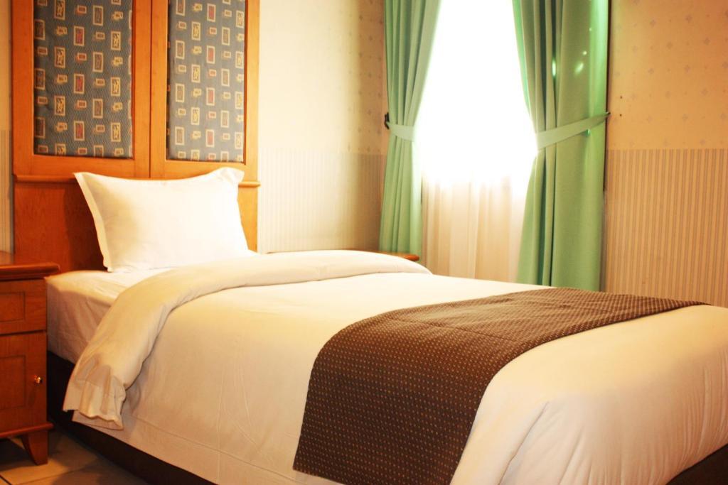 Travellers Suites Serviced Apartments Medan Szoba fotó